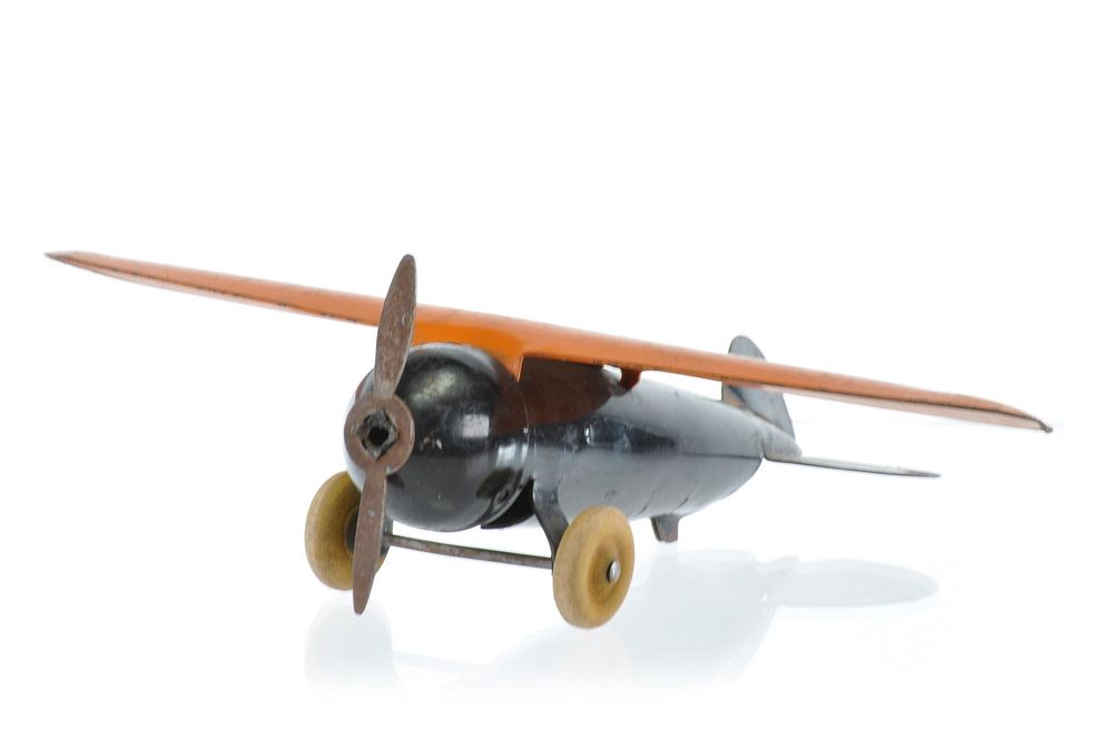 Lot 279: Wyandotte No. 201 Orange and Black Steel Propeller Plane