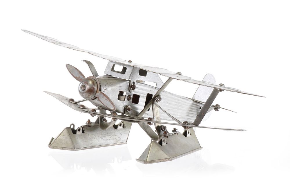 Lot 284: Silver Steel Biplane Toy Found in South America