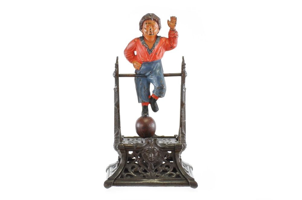 Lot 315: J. Barton Smith Co. Cast Iron “Boy on Trapeze" or “French’s Automatic Toy Bank" Mechanical