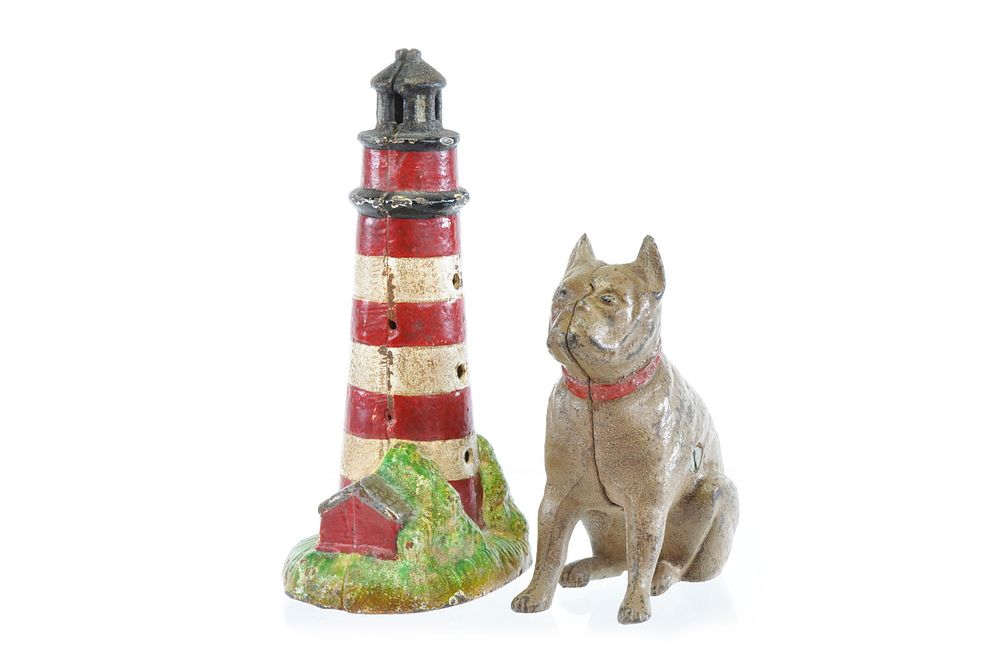 Lot 319: Hubley Cast Iron No. 826 Sitting Bulldog Bank & Cast Iron Light House Still Bank Lot of 2