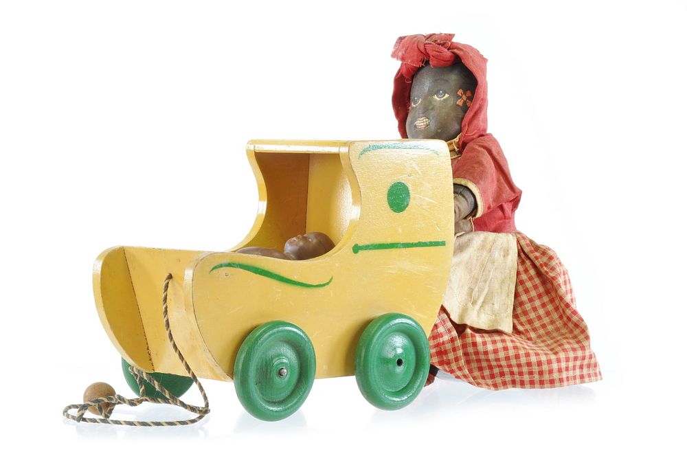 Lot 339: Black Americana Pull Toy Cloth Mammy Pushing Porcelain Black Baby in Wooden Baby Carriage