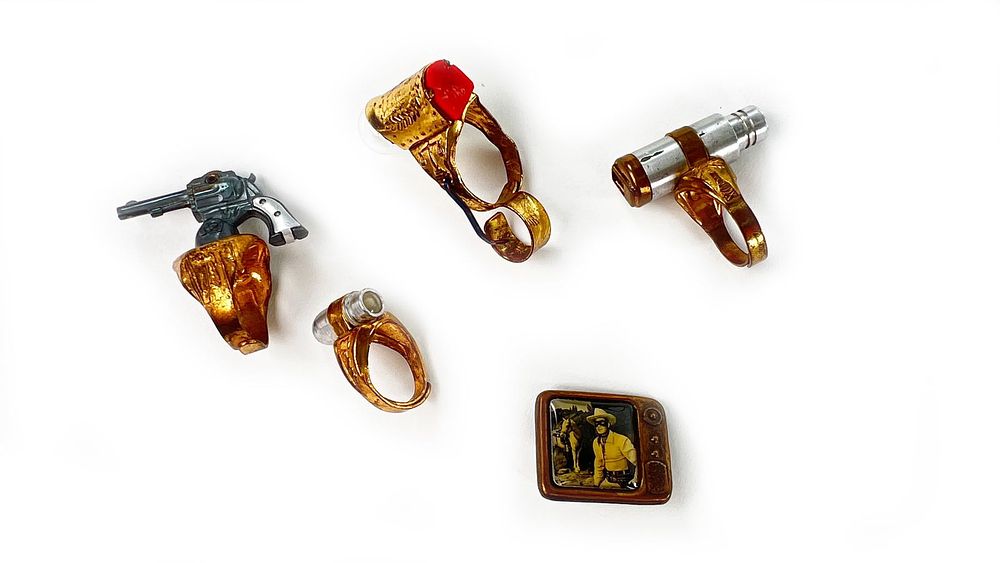 Lot 354: Lone Ranger Premium Cereal Rings: Flashlight Signal, Atom Bomb, 6-Shooter Rings, Film Strip!