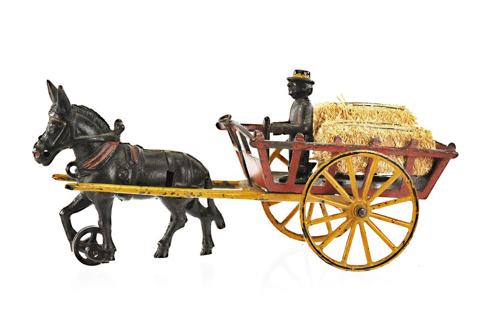 Lot 383: Early Harris Hay Wagon with Black Cast Iron Driver
