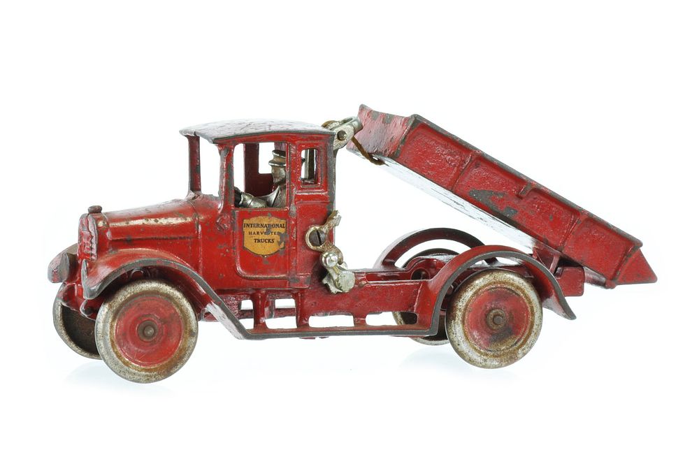 Lot 410: Arcade Red Baby Dump Truck I.H. Cast Iron Truck