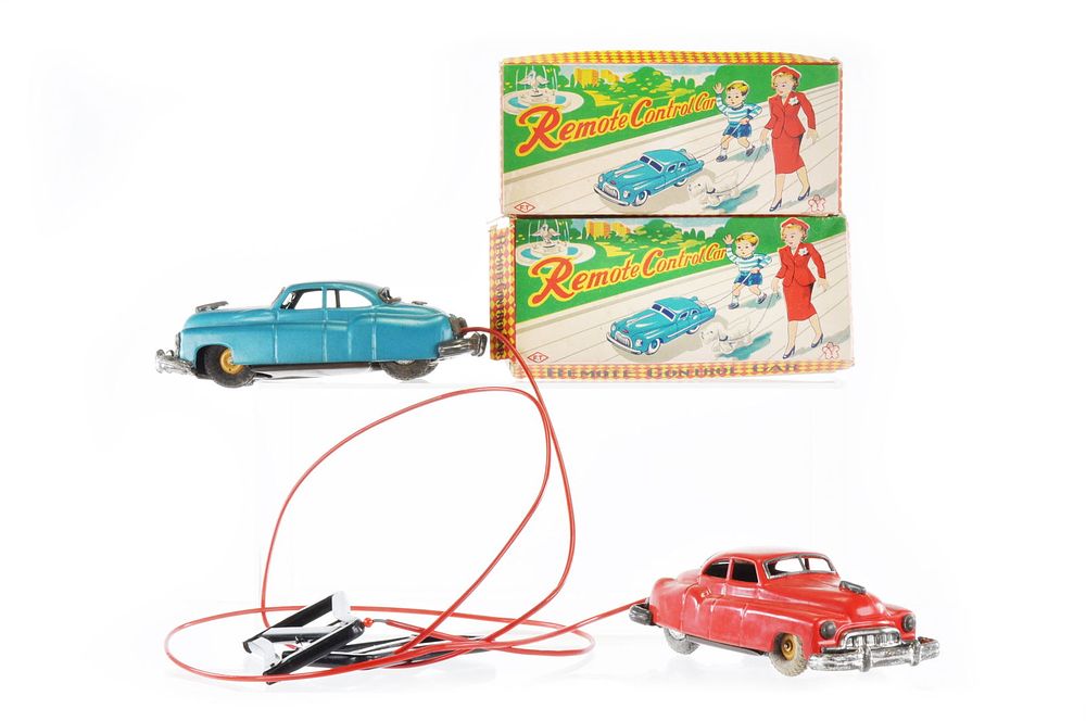Lot 426: Two Boxed Remote Control Tin Cars by F.T. and Yone, Japan