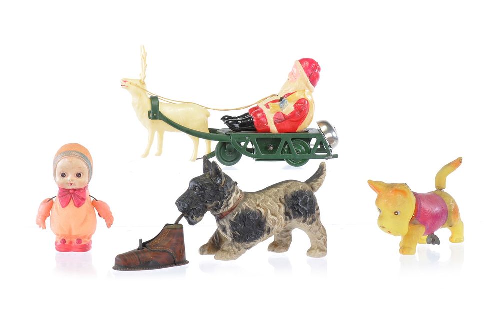 Lot 428: Charming Celluloid Baby, Santa's Sleigh, and Scotty Dog Windup Lot of 4