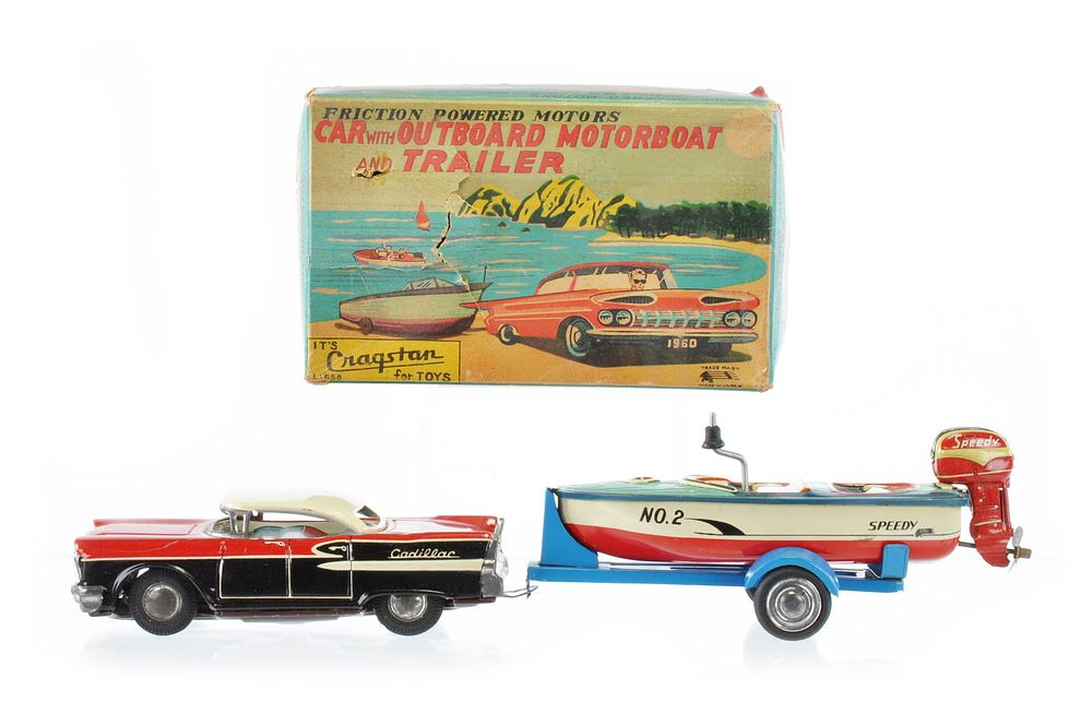 Lot 449: Cragstan Car with Outboard Motorboat Tin Vehicle Set Boxed