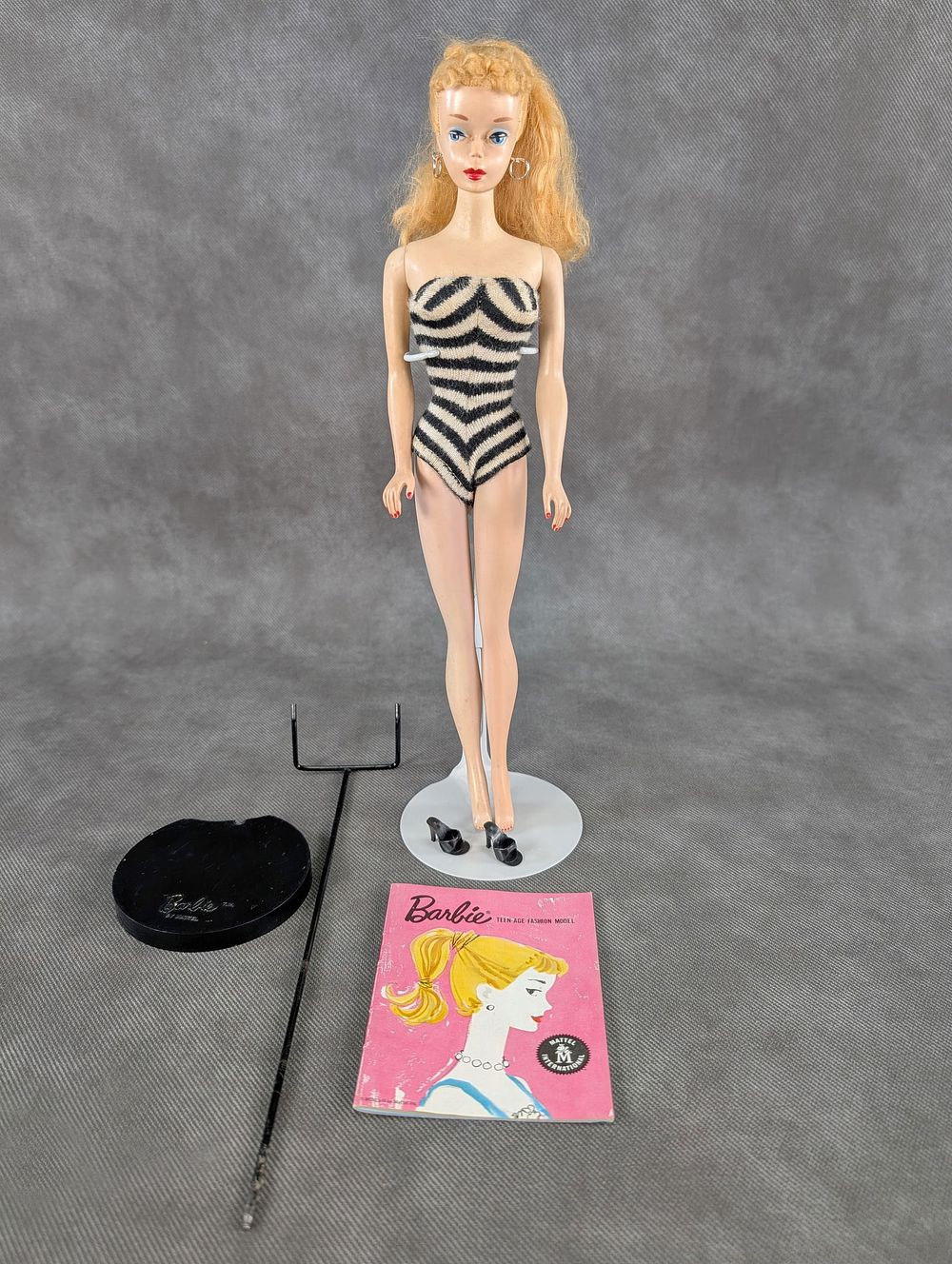 Lot 152: #3 Barbie Blonde barbie Doll with Stand and Booklet