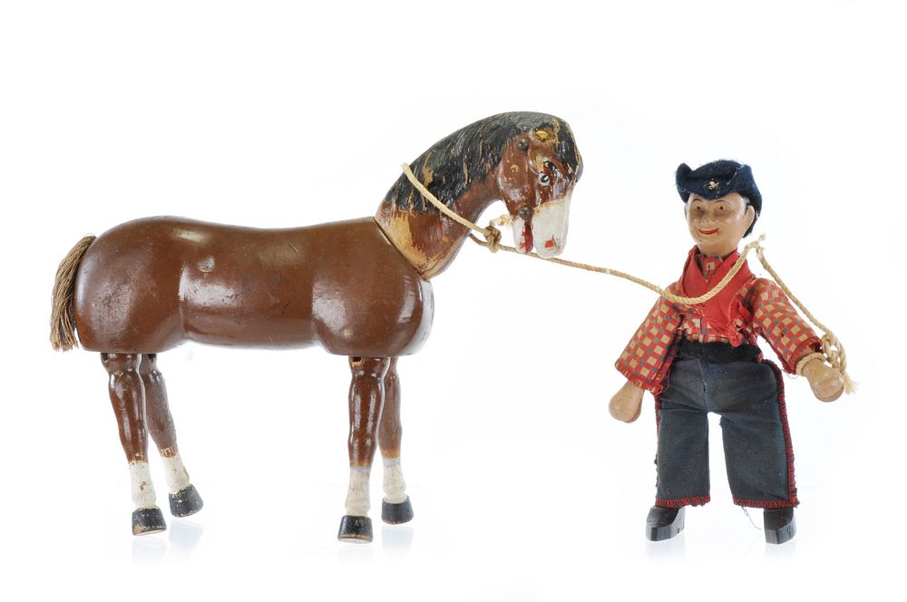 Lot 212: Schoenhut Cowboy and Horse Figures