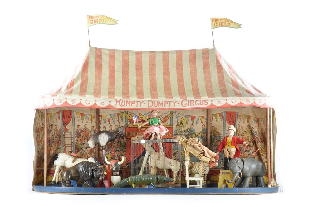 Lot 240: Extra Large Humpty Dumpty Circus Tent, Partial Side Show Flap, and Exotic Wooden Animals.