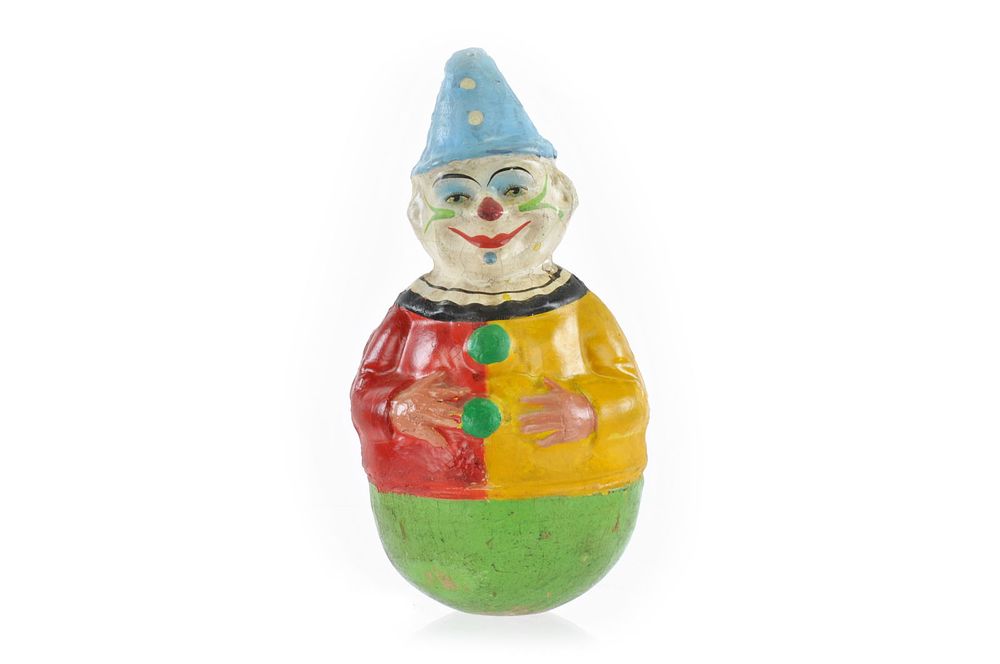 Lot 261: Schoenhut Red and Yellow Rolly Dolly