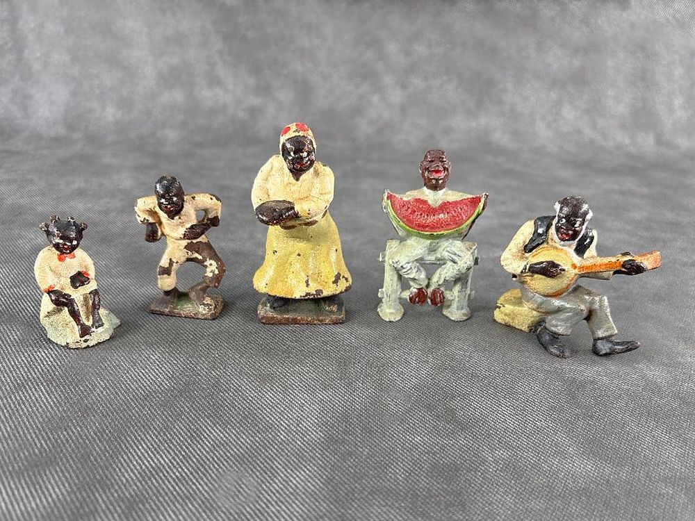Lot 277: Set of Antique Black Family Cast Iron plus Manoil Boy on Fence