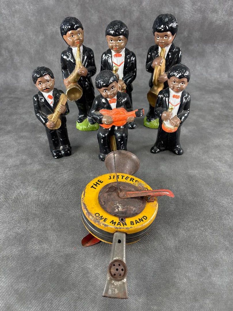 Lot 280: Lot of 6 Black Ceramic Musicians + One man Band Toy