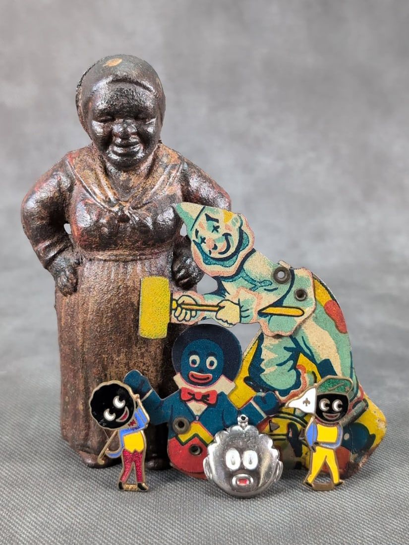 Lot 310: Cast Iron Mammy Bank & Golly Golliwog Tin Litho Clicker