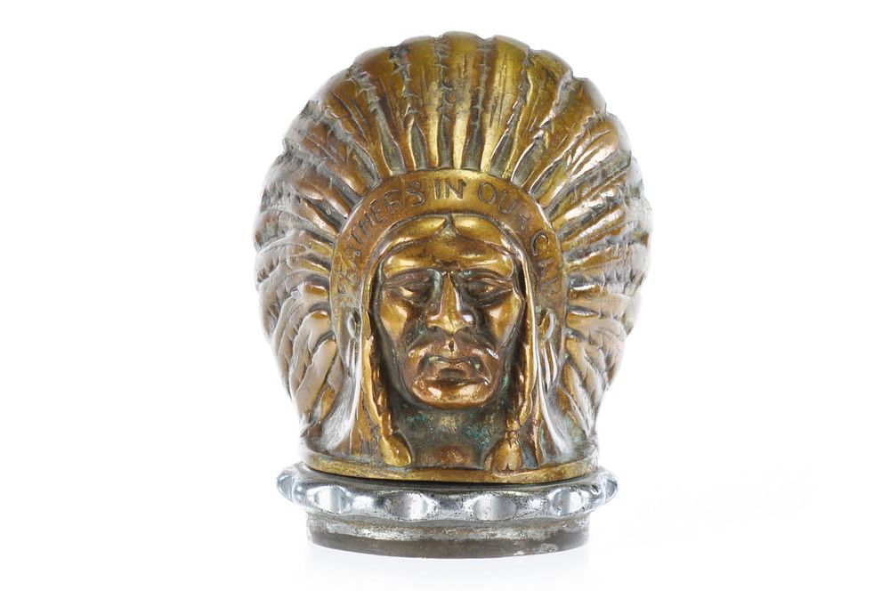 Lot 244: Guy Brothers Native American Indian Hood Ornament