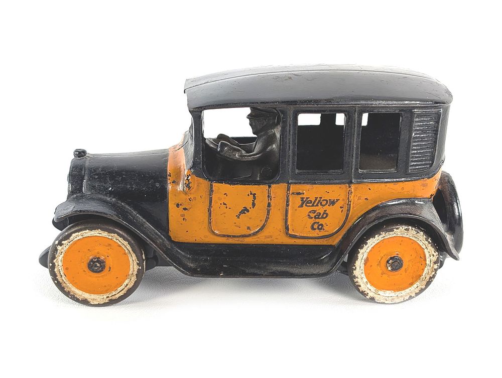 Lot 284: Large Arcade Cast Iron Yellow Cab w/Metal Tires & Driver