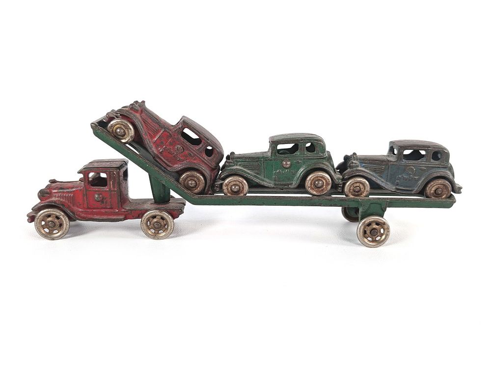 Lot 290: A.C. Williams Red & Green Cast Iron Car Transport w/3 Austin Cars & Metal Tires