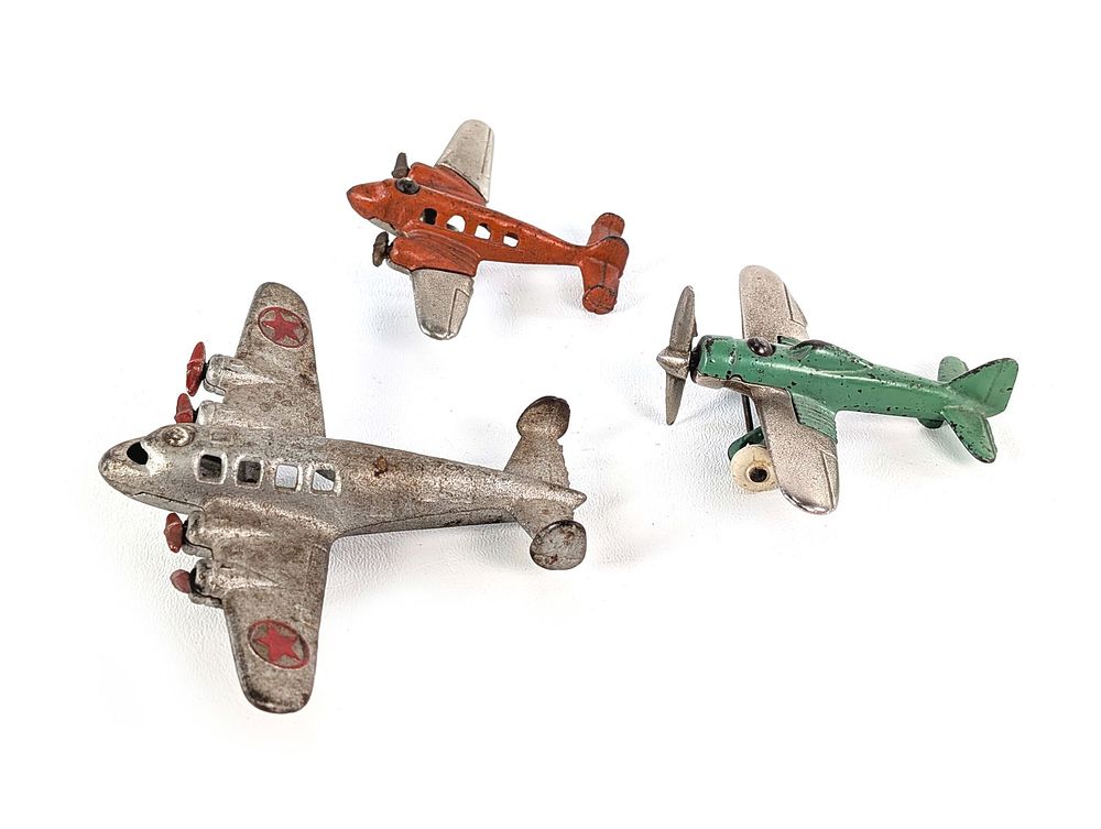 Lot 291: Set of 3: Hubley Silver, Orange & Green Cast Iron Airplanes w/Rubber Tires