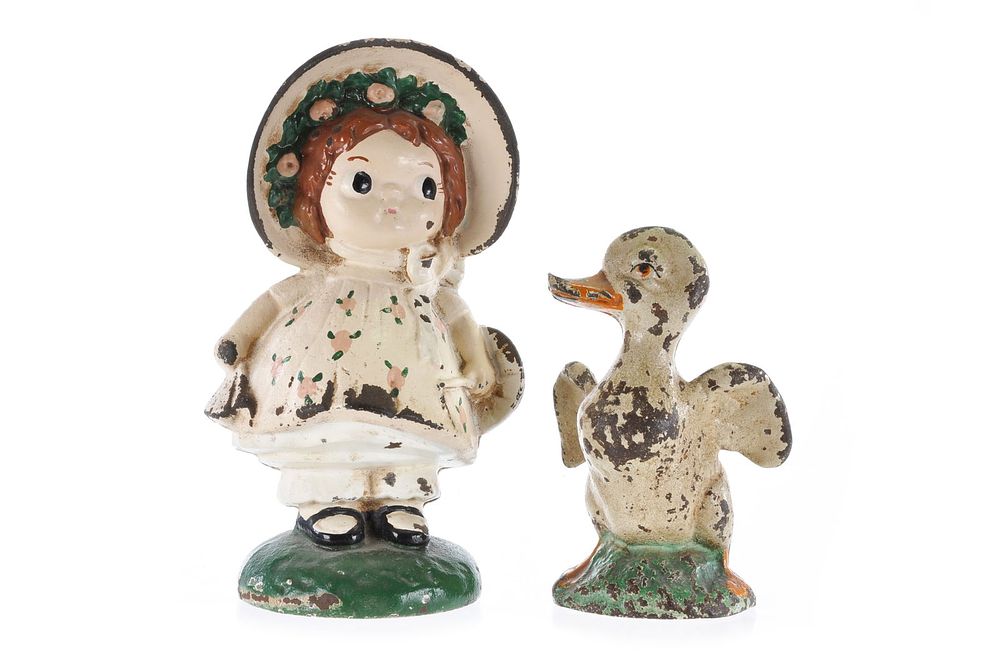Lot 314: Hubley Set of 2 Cast Iron Still Banks Sunbonnet Sue (Dolly Dimple) and Duck