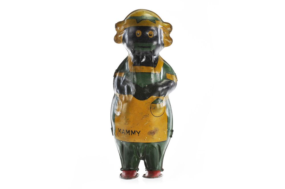 Lot 344: Lindstrom Green and Yellow Dancing Mammy Tin Windup Toy