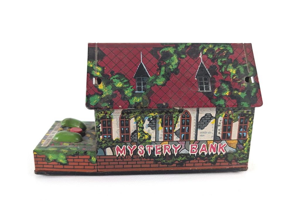 Lot 374: Japanese TN Windup Tin Litho Mystery Bank Works