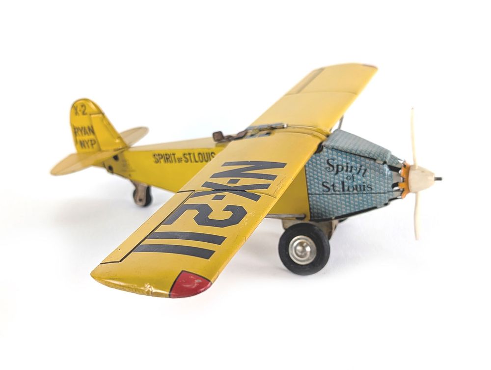 Lot 383: HTC Japanese Tin Litho Friction Airplane Spirit of St. Louis NX211 Works