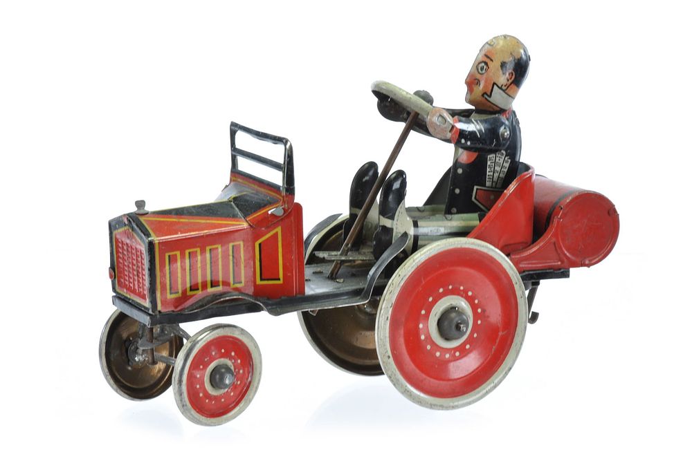 Lot 424: Marx Coo Coo Car Tin Windup with Rider