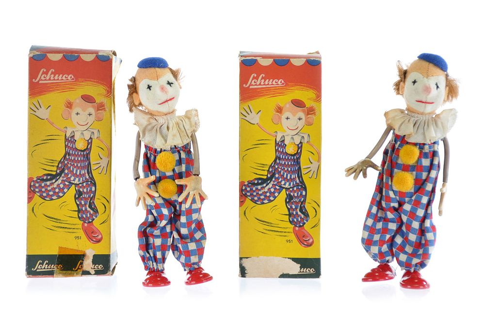Lot 449: Unusual Schuco Boxed Clown Set of 2 Windups