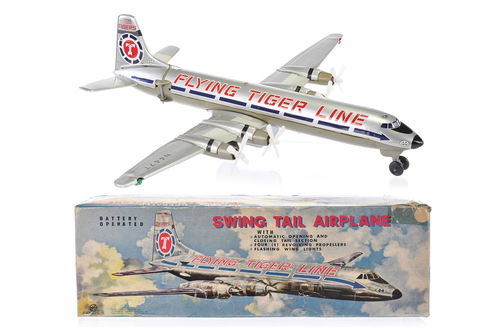 Lot 466: Deluxe Swing Tail Marx Flying Tiger Airplane Boxed
