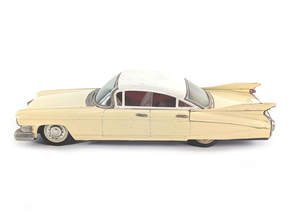 Lot 490: Japanese Tin Litho Yellow Friction Cadillac Works