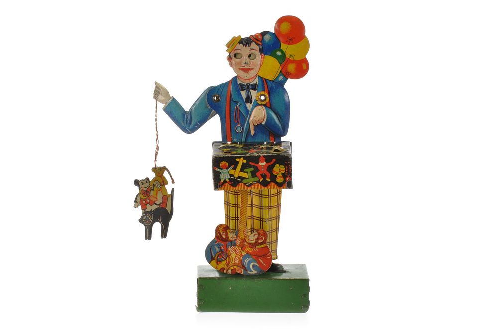 Lot 508: J. Distler Toy Peddler Tin Windup with Mickey Mouse
