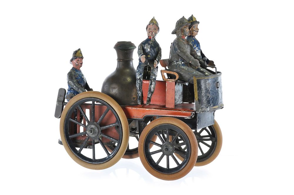 Lot 509: Gunthermann 1900s Fire Pumper with Men Tin Windup