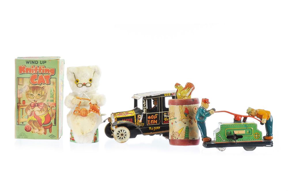 Lot 517: TN Knitting Cat Japanese Windup, Marx Jalopy, Stanley Novelty Chicken, Hand Cart, Lot of 4