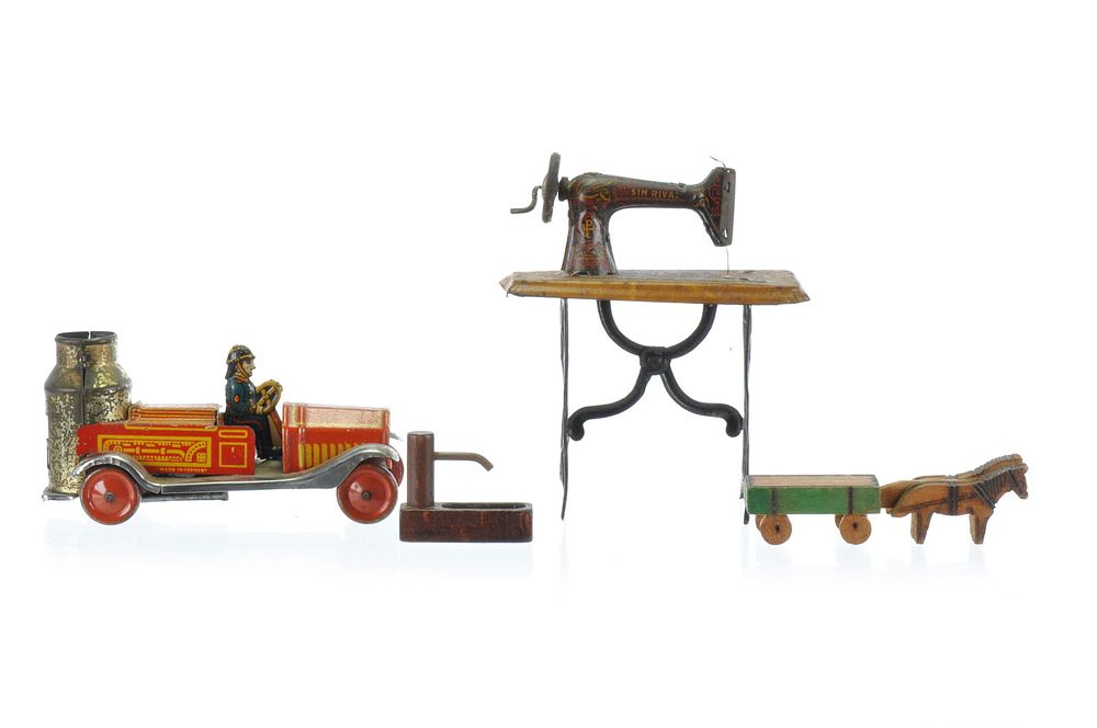Lot 536: Paya Tin Sewing Machine, and German Penny Toy Tin Lot