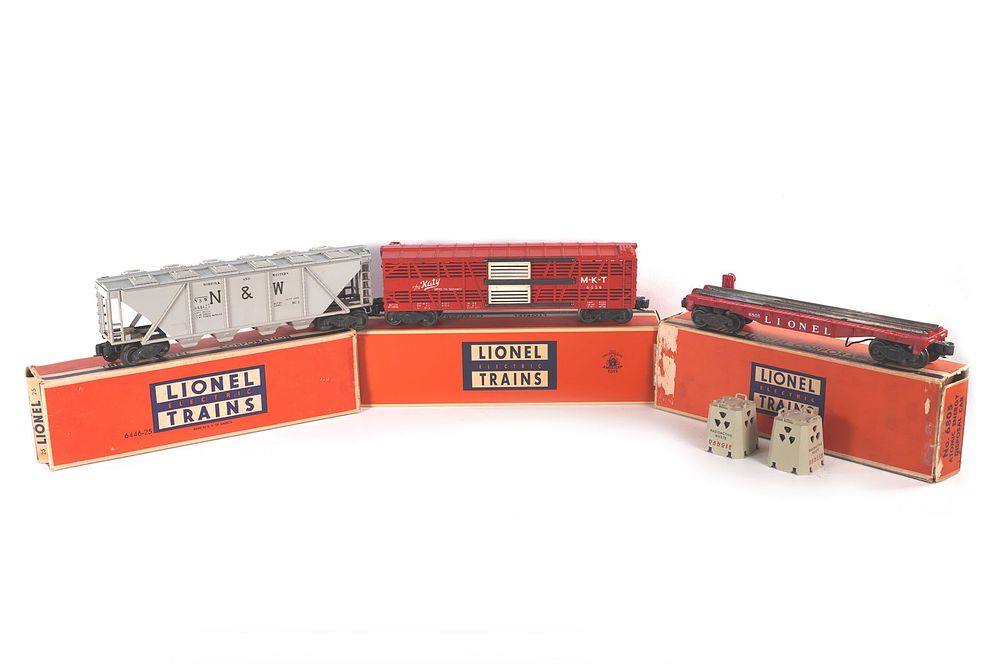 Lot 768: Lionel Cement Car 6446 Atomic Energy Disposal 6805 & MKT Stock Car 6556 Boxed