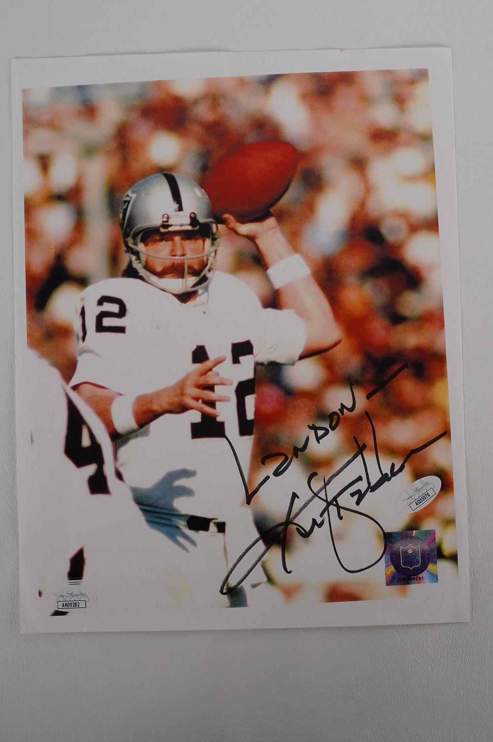Lot 599: Ken Stabler No. 12 AUTOGRAPHED 8.5 x 11 Color Photo Las Vegas Raiders w/COA