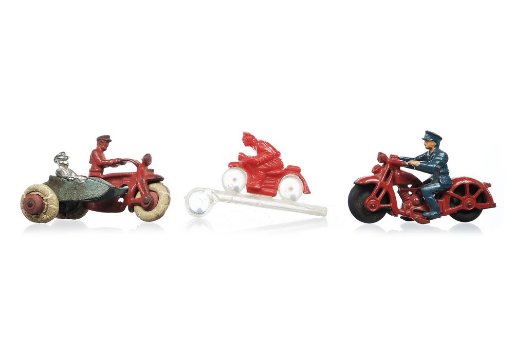 Lot 265: 3 1930s Motorcycle Cops Hubley Cast Iron #376 and #399 and Plastic Whistle