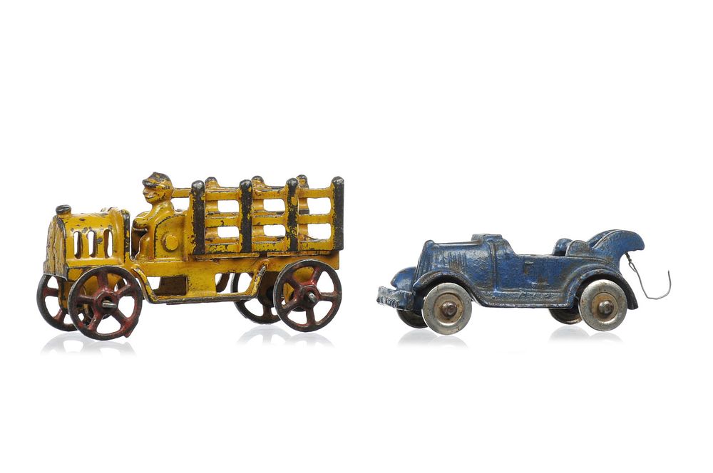 Lot 275: Hubley Cast Iron Yellow Stake Truck and Blue Wrecker 4" Lot of 2