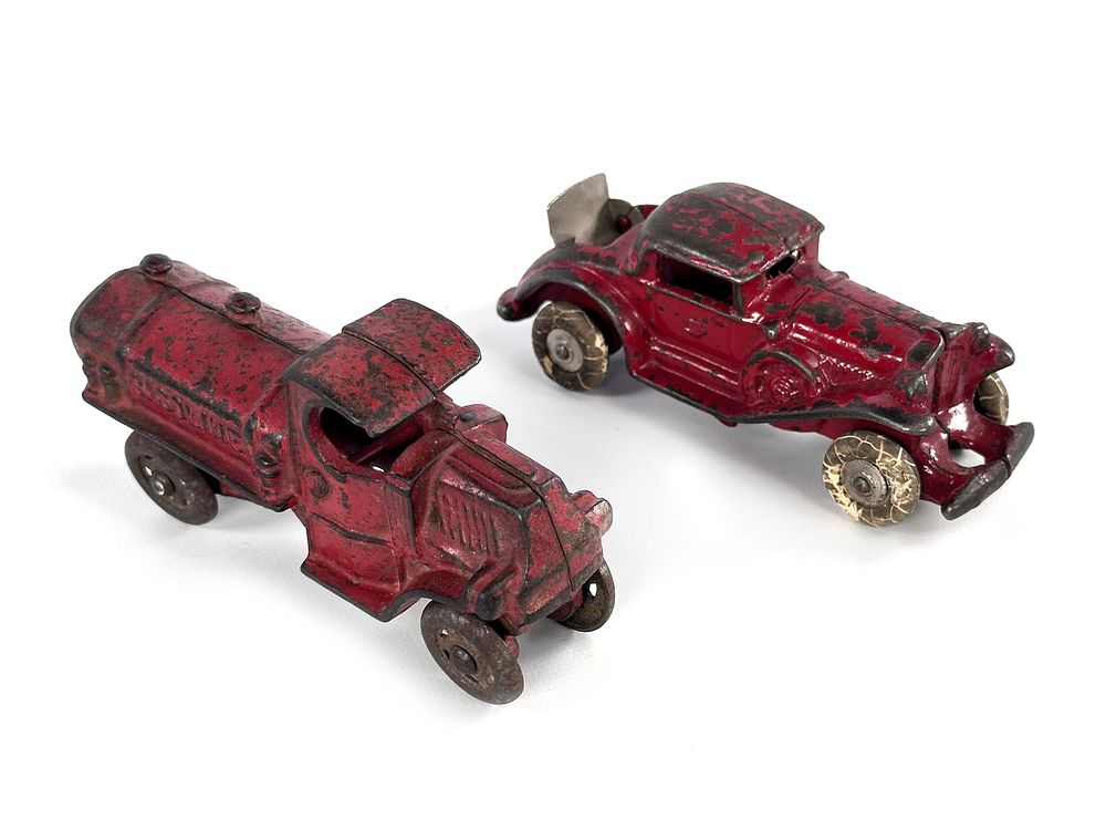 Lot 280: Pair of Williams Gas Truck and Cord Cast Iron