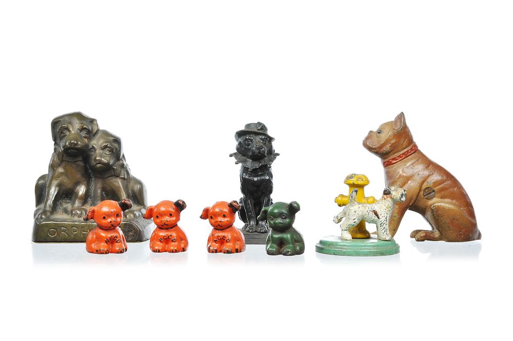 Lot 305: Lot of 8 Cast Iron Dogs Advertising Pups, Dog Bank, Matchholder, Bookend, and Scotty