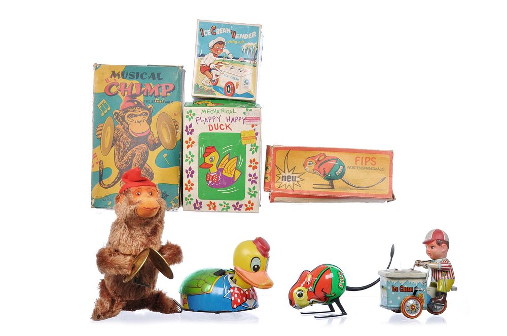 Lot 329: 4 Boxed Tin Litho Windup Toys Alps, Easter, German, and Japanese