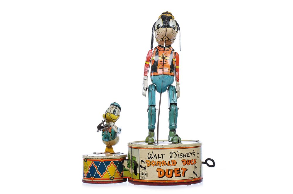 Lot 330: Marx Tin Litho Windup Donald Duck Duet with Goofy Disney Jigger