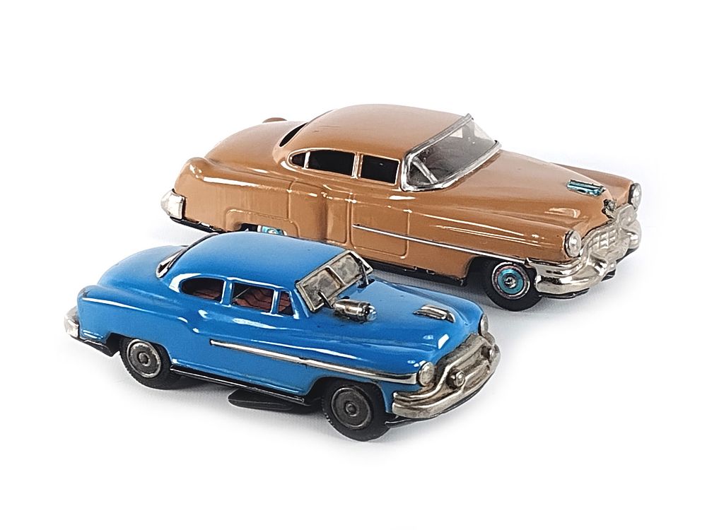 Lot 352: 2 Japanese Tin Batt. Op. Cadillacs; Nomura