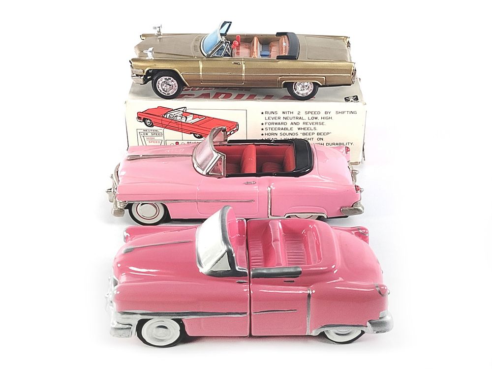 Lot 359: 2 Cadillacs: Bandai Golden Cadillac Boxed, Pink Cadillac Bookends & Tin Car