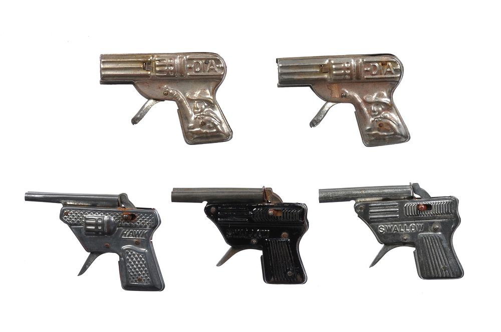 Lot 390: 5 1950s Japanese Tin Cap Pistols, Small Silver Swallow, Hawk, and DIA (2) & Black Swallow