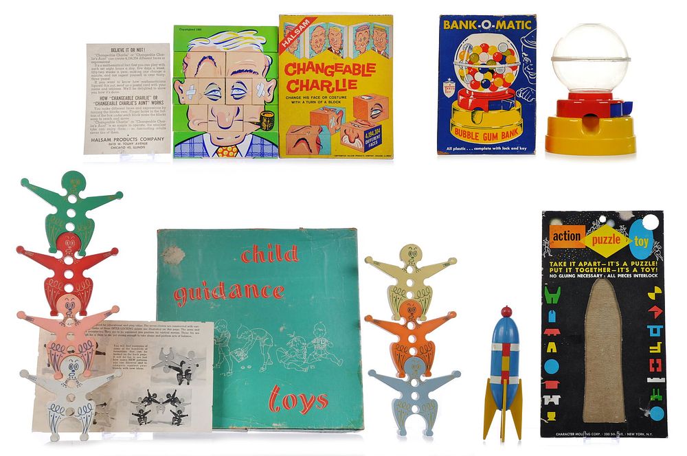 Lot 325H: 1960s Game Set of 4 Bank-O-Matic, Changeable Charlie, Rocket Puzzle, Stacking Clowns
