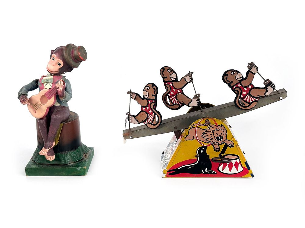 Lot 341J: Celluloid Guitar Monkey and Wolverine Monkey See-Saw