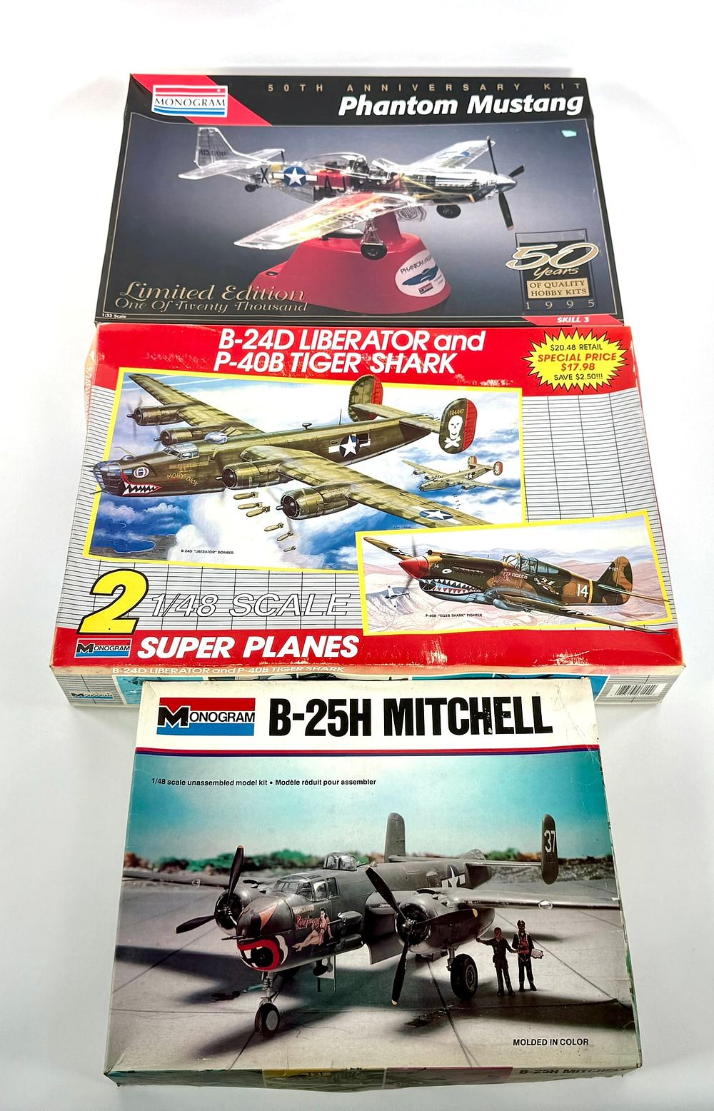 Lot 58: 4 Monogram Model Kits B-25H Mitchell/50th Anniv Phantom Mustang/B-24D Liberator/P-40B Tiger Shark