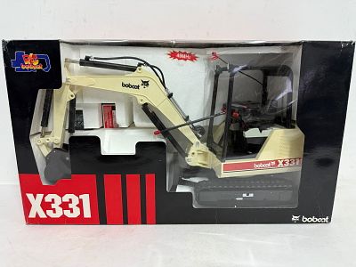 Radio Control Bobcat X331, 49 MHz, corners have some damage on box, MIB and unused. Condition: GOOD