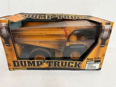 Motorworks R/C Dump Truck, box has some damage, ready to run with 9.6V battery, MIB and unused. 